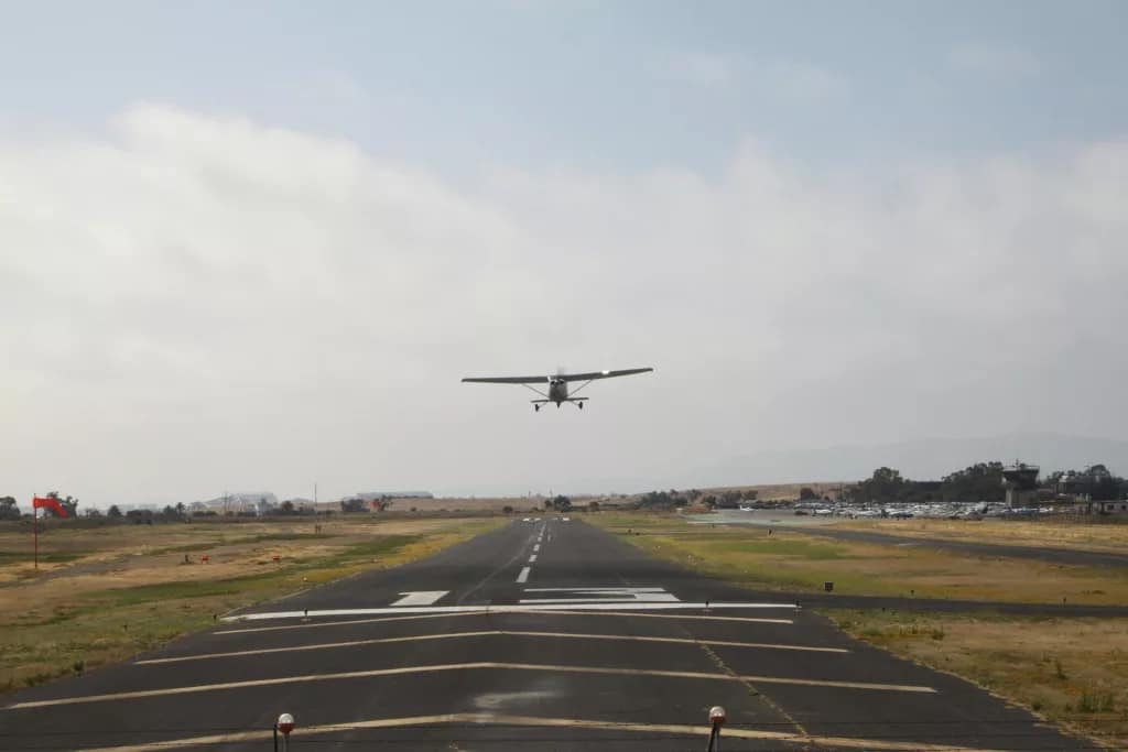 Fixed-wing surveying aircraft departure for international aerial survey deployment and large-scale mapping